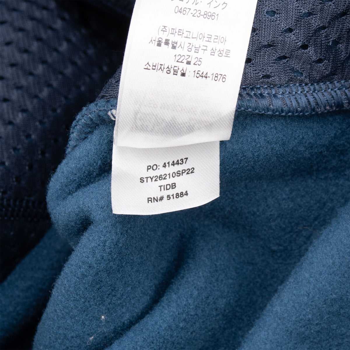 Interior care tag showing Patagonia style 26210 and SP22 season code