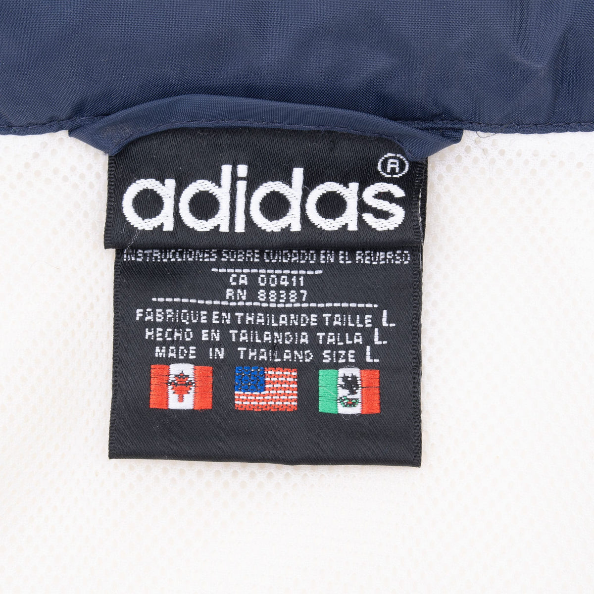Adidas neck label showing style code CA 00411 and size large