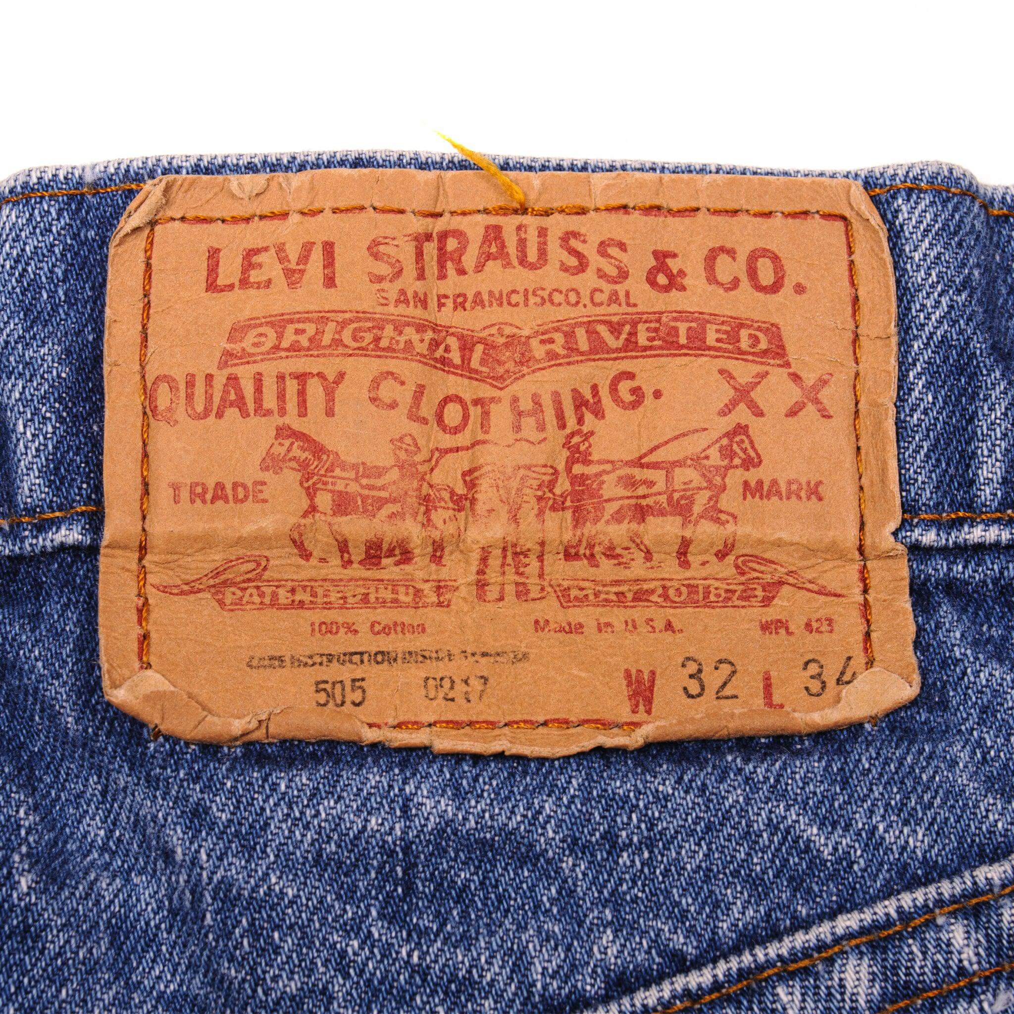 Beautiful Indigo Levis 505 Jeans Made in USA with a medium blue wash and a nice contrast between medium and light blue.  Size on Tag 32X34  ACTUAL SIZE 31X34  Back Button #552