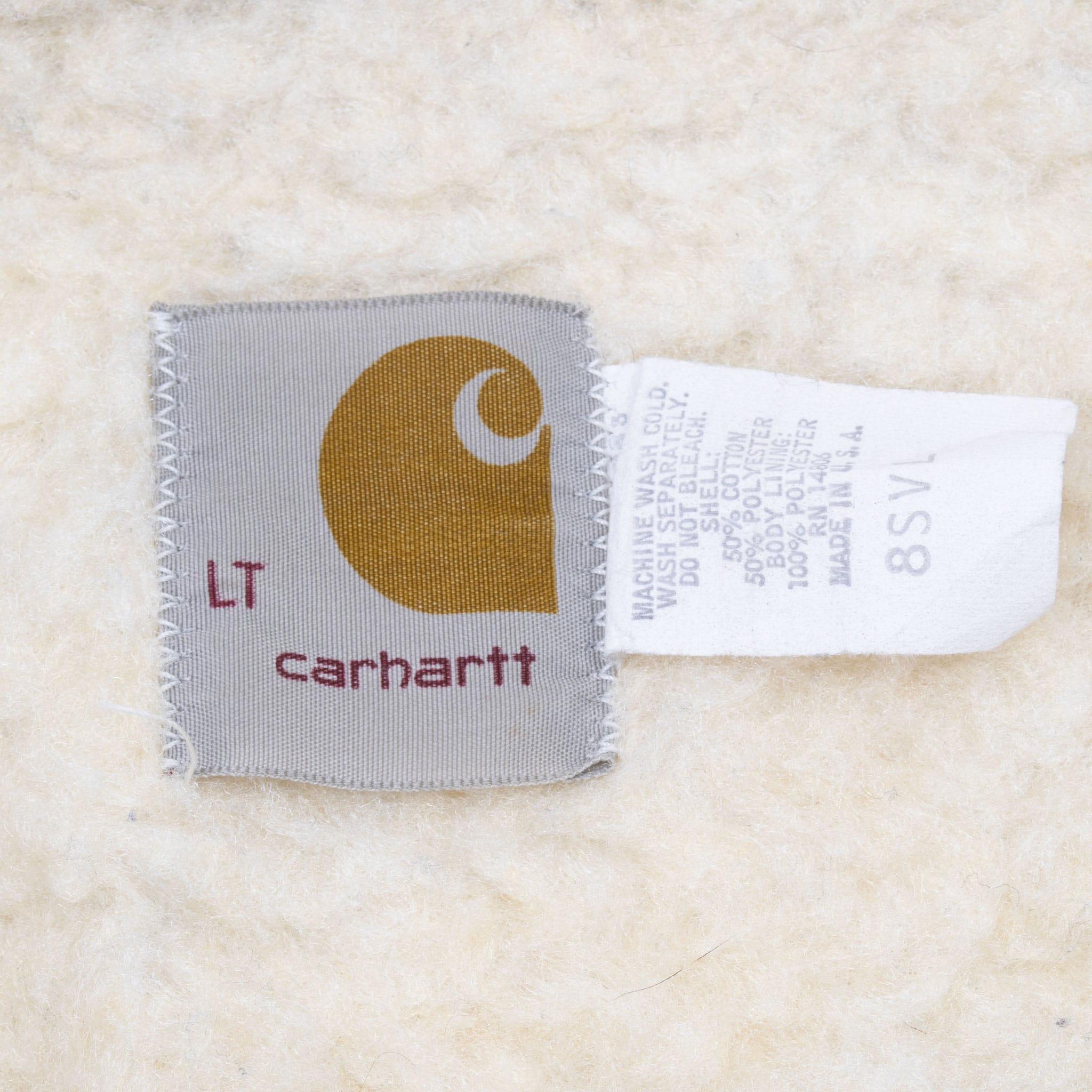 Carhartt LT logo and care labels stitched to cream sherpa lining