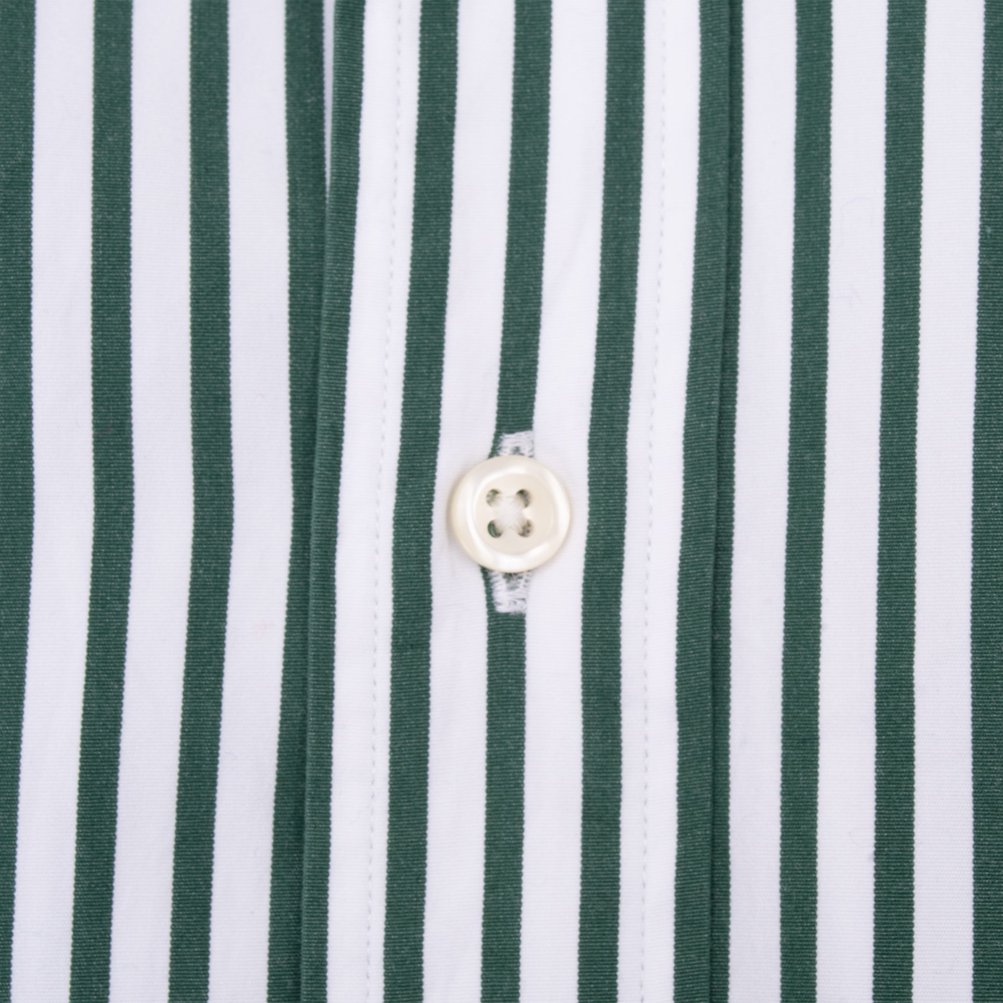 White front button detail on Ralph Lauren green and white striped shirt