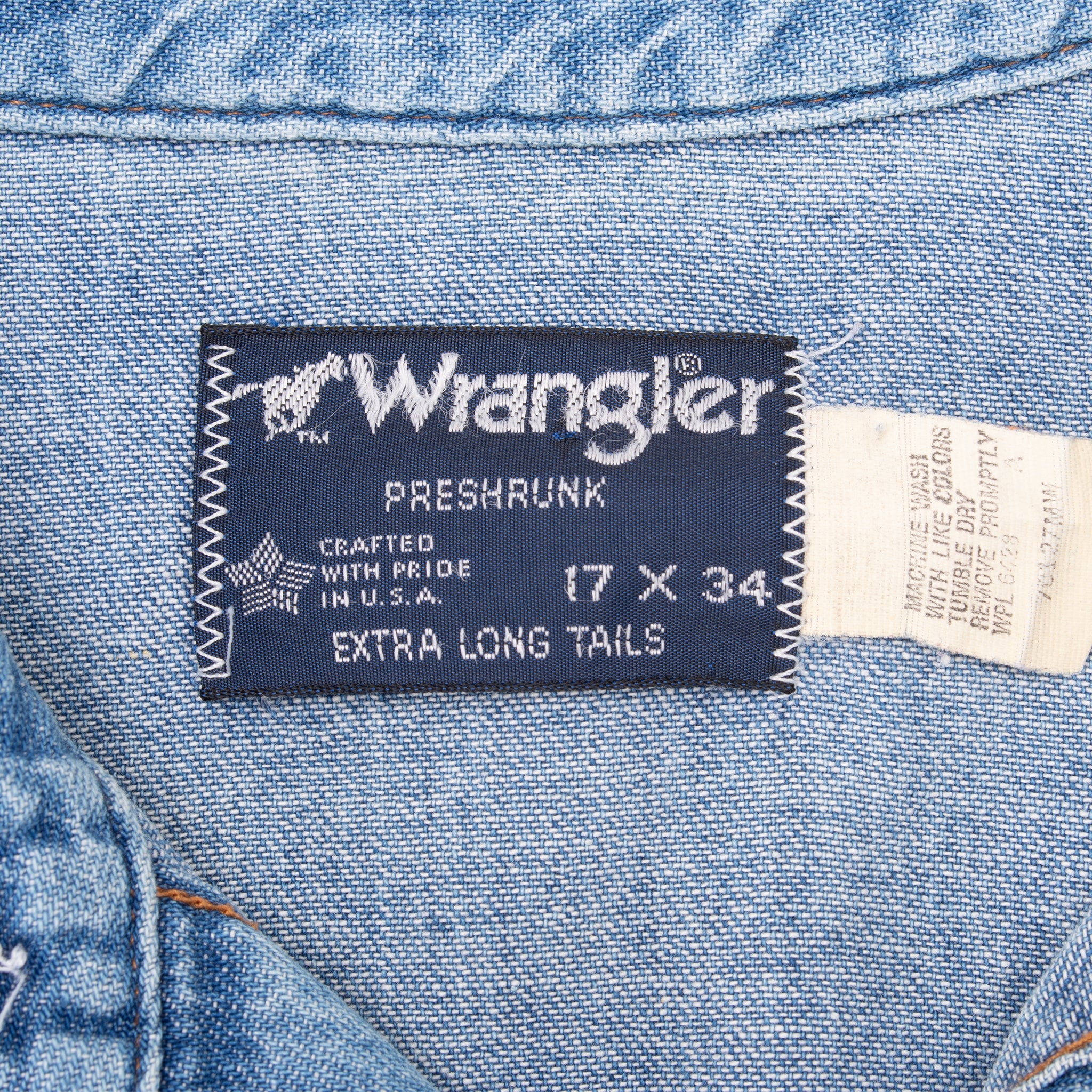 Wrangler collar label showing preshrunk, 17 x 34, and extra long tails