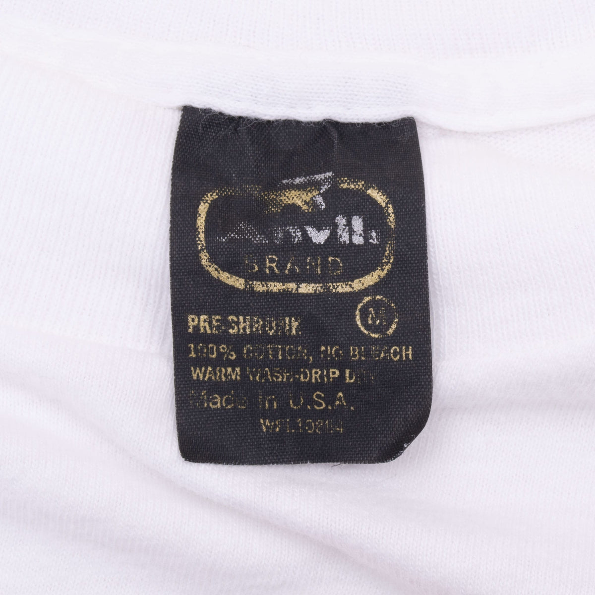 Close-up of black neck tag with size small and care instructions