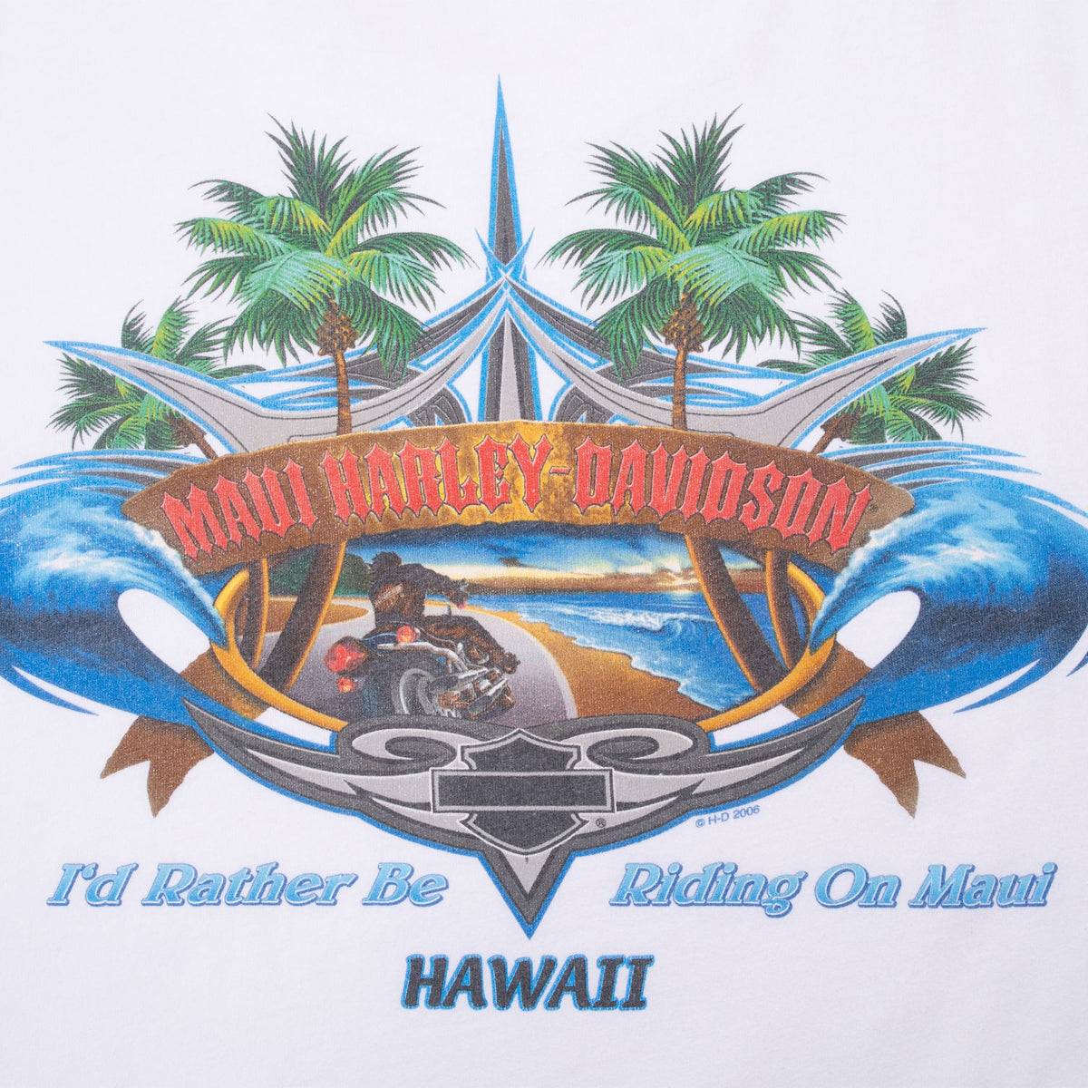Close-up of Maui Harley-Davidson back print with motorcycle, coastline, palms and waves