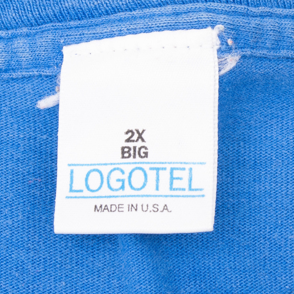 Logotel 2X Big Made in U.S.A. neck tag on blue T-shirt