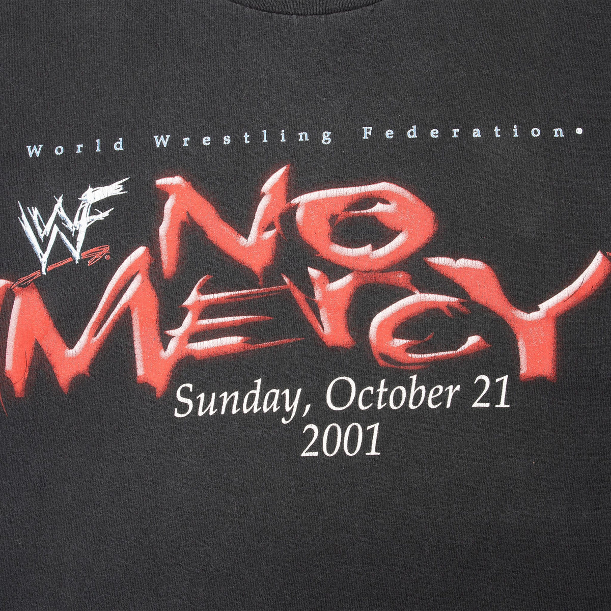 Close-up of front WWF No Mercy logo and Sunday, October 21, 2001 date print