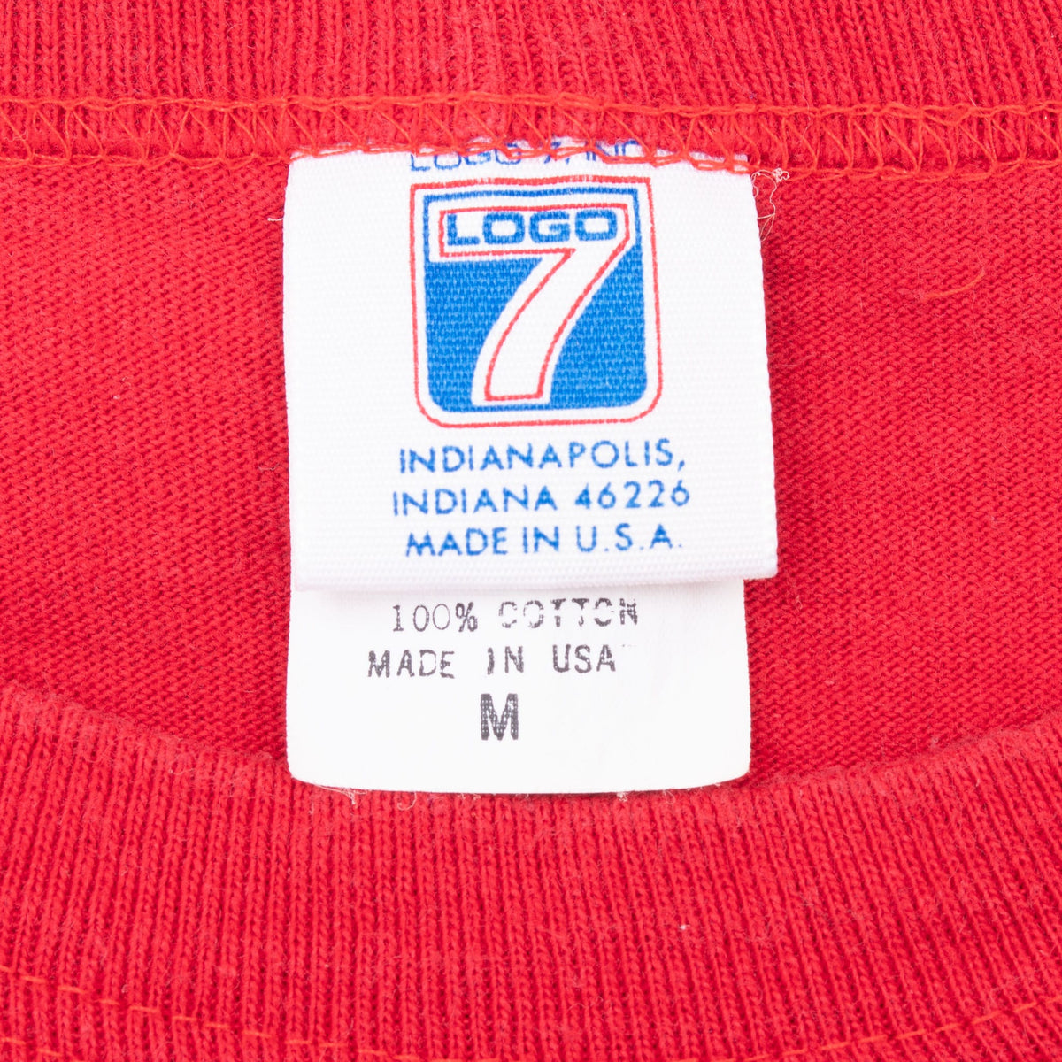 Logo 7 neck tag marked 100% cotton, made in USA, size M