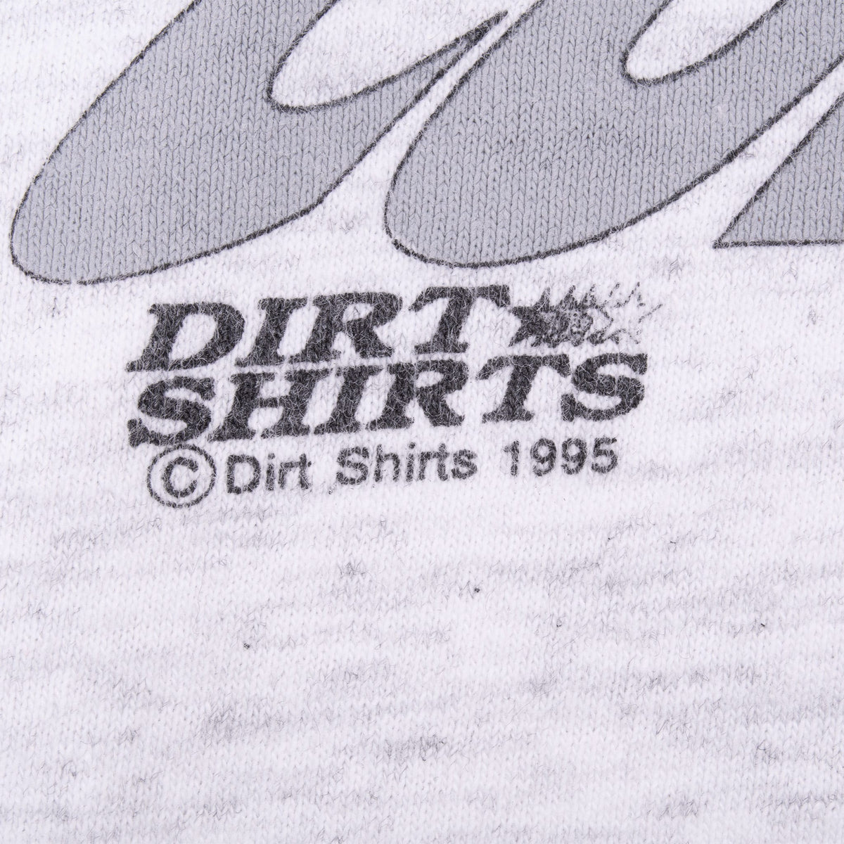 Detail of Dirt Shirts 1995 copyright mark beneath the back graphic