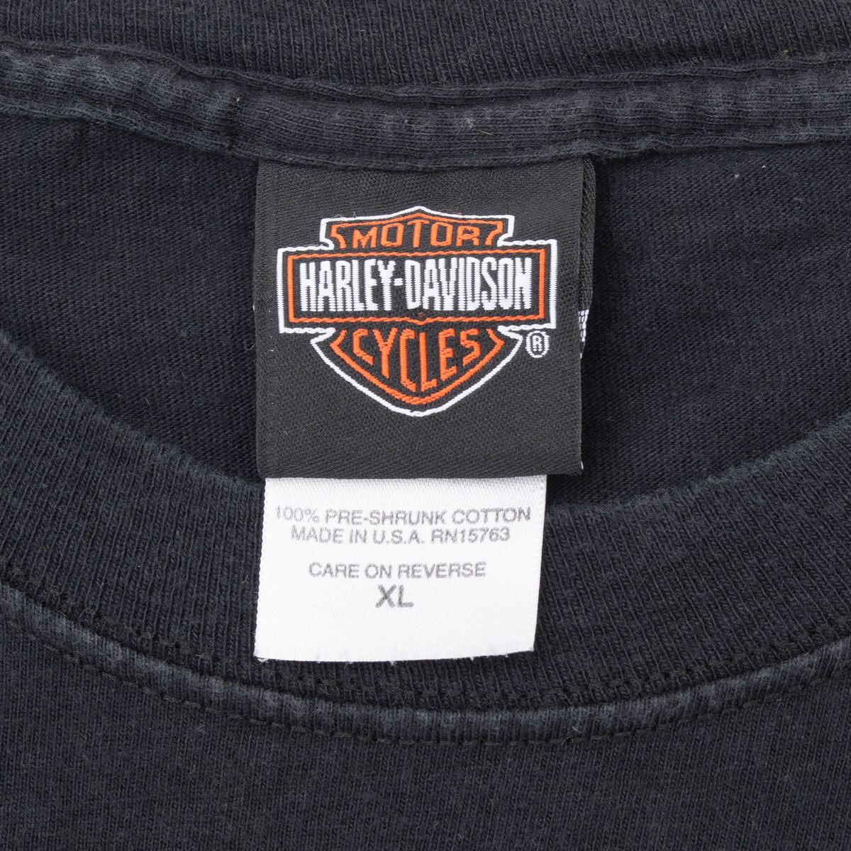 Harley-Davidson neck tag and XL care label inside black T-shirt