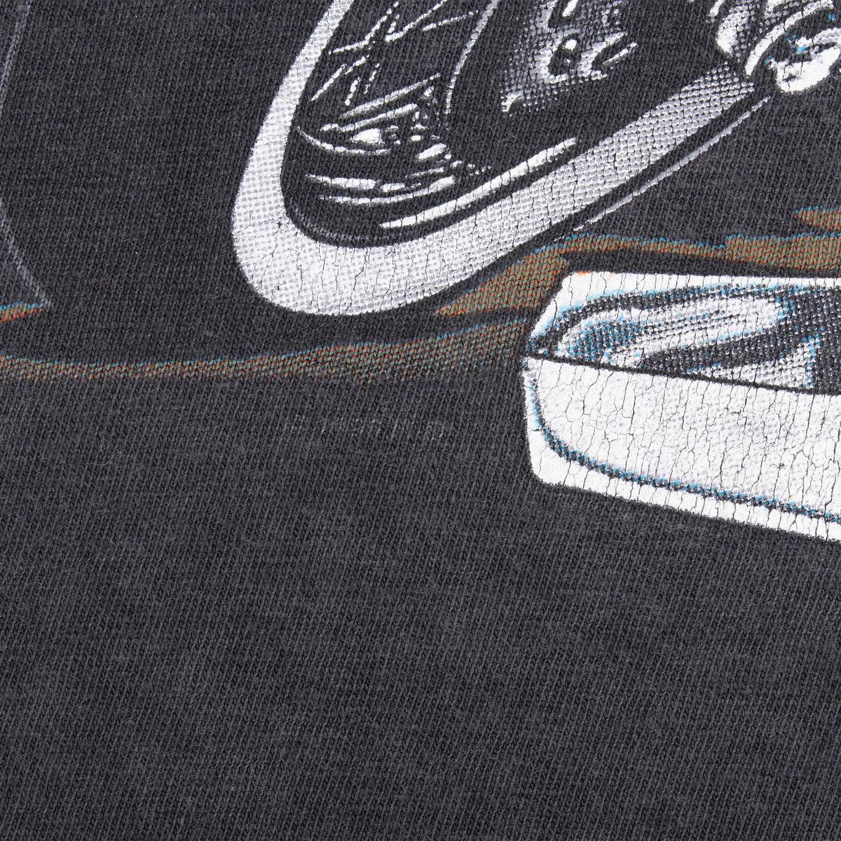 Close-up of cracking and wear on the Harley-Davidson motorcycle print