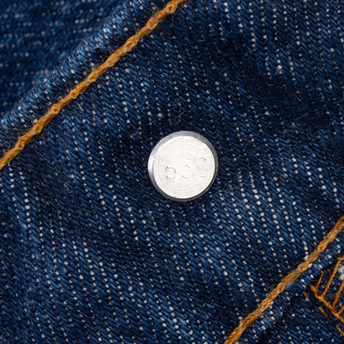 Close-up of the interior waistband button stamped 532 on Levi's 505 jeans