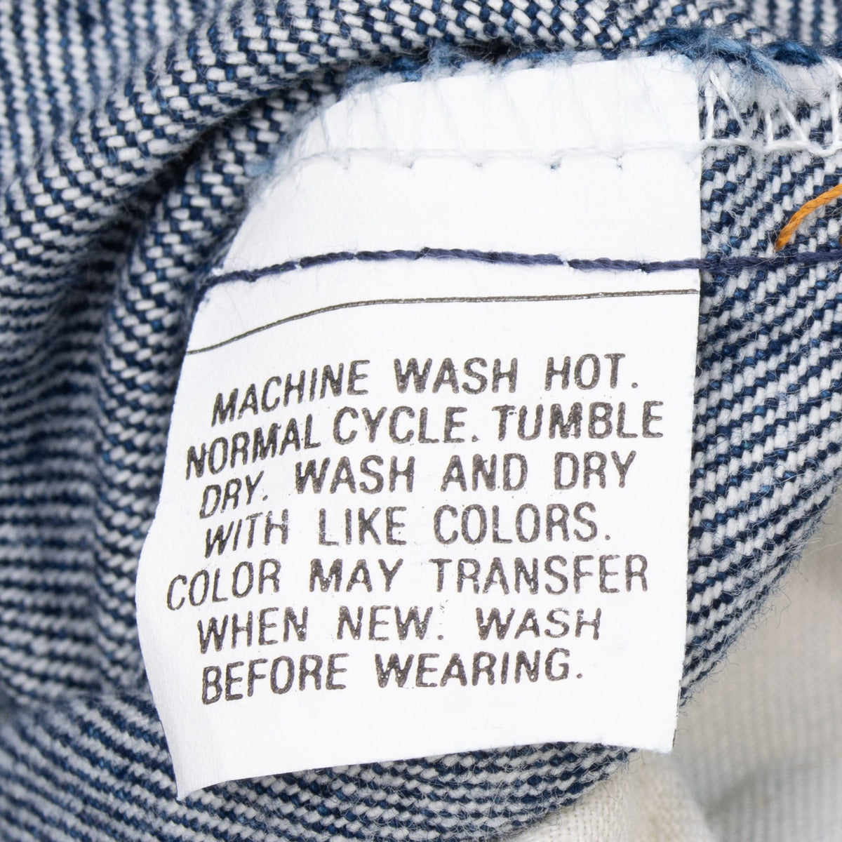Close-up of the printed washing instruction label inside Levi's 505 jeans