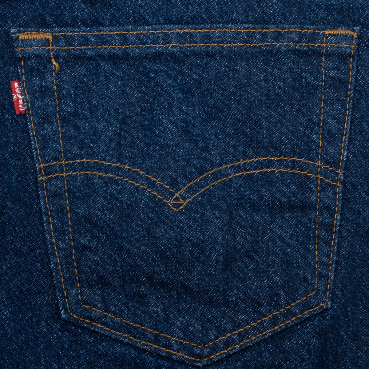 Close-up of a Levi's back pocket with red tab and arcuate contrast stitching
