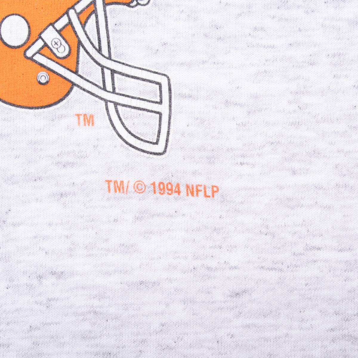Close-up of orange Browns helmet graphic and 1994 NFLP copyright print