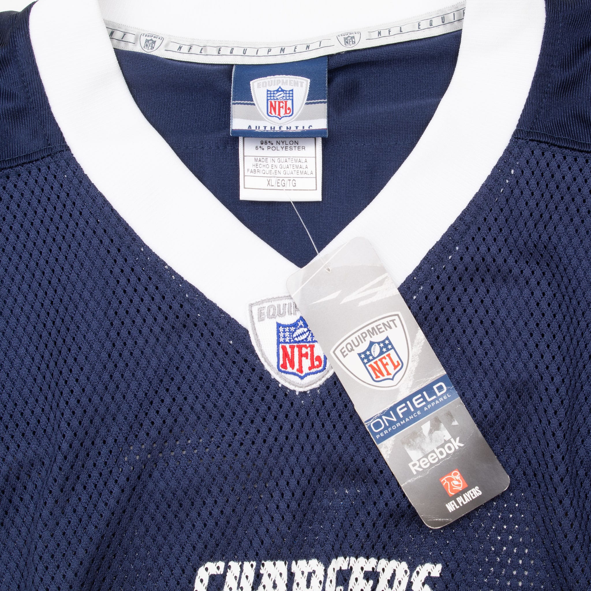 Reebok NFL neck label and hangtag inside white V-neck of navy Chargers jersey
