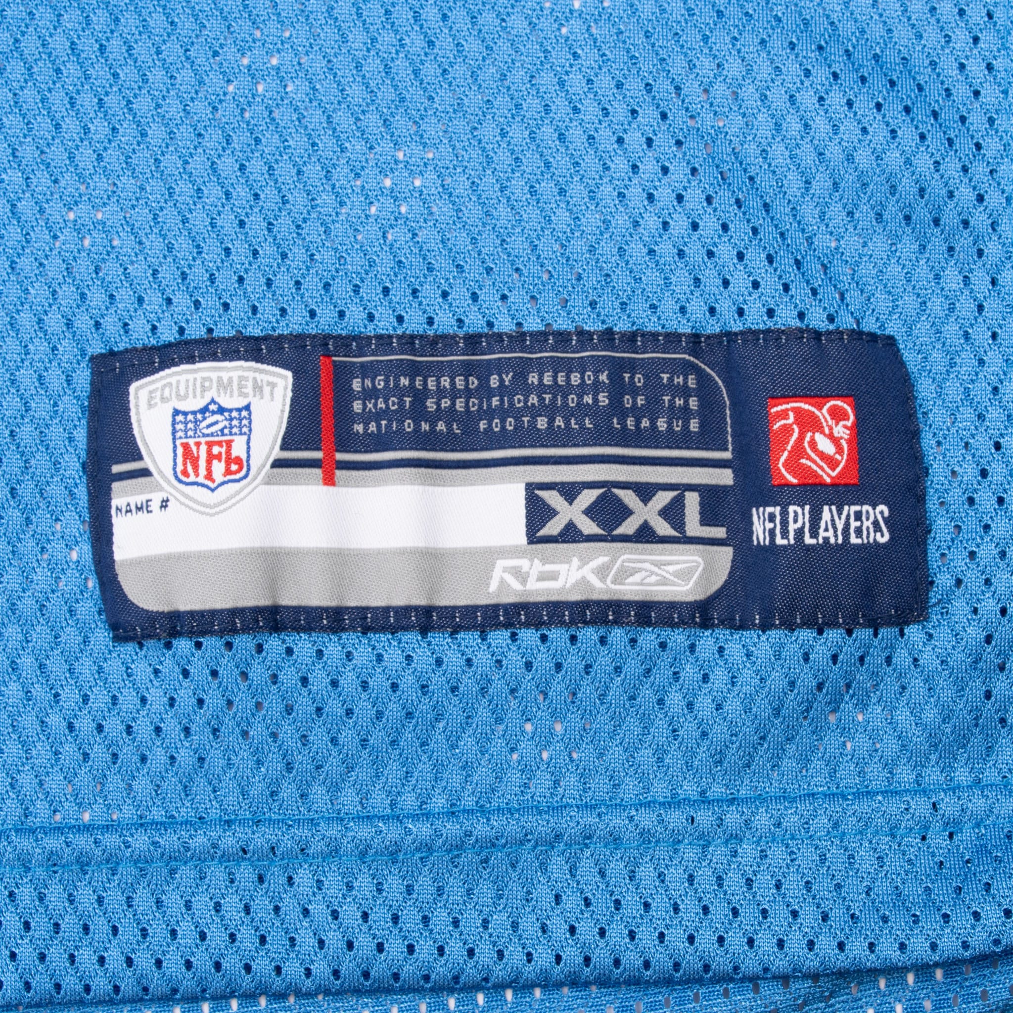 Reebok NFL Equipment XXL hem label stitched to powder blue mesh jersey fabric