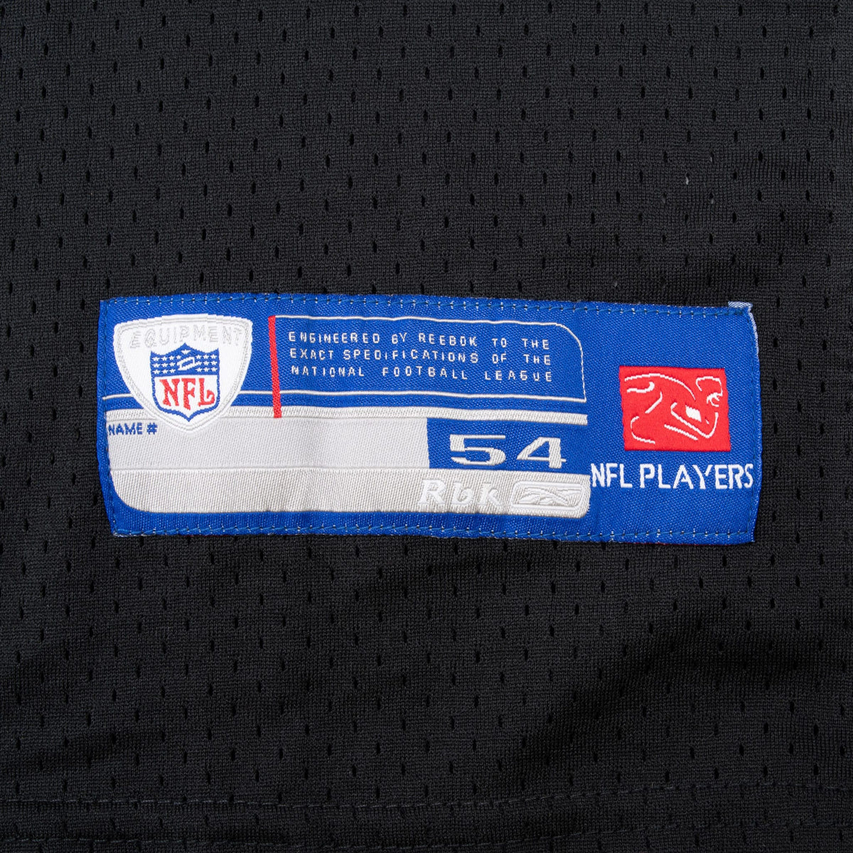Reebok NFL Players size 54 jock tag stitched near the hem of the black jersey