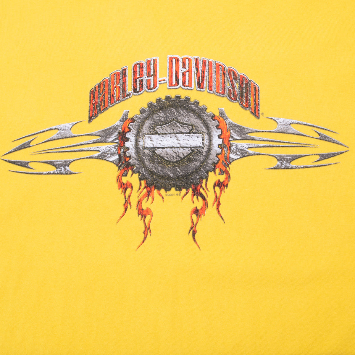 Close-up of front Harley-Davidson flaming gear and bar-and-shield graphic
