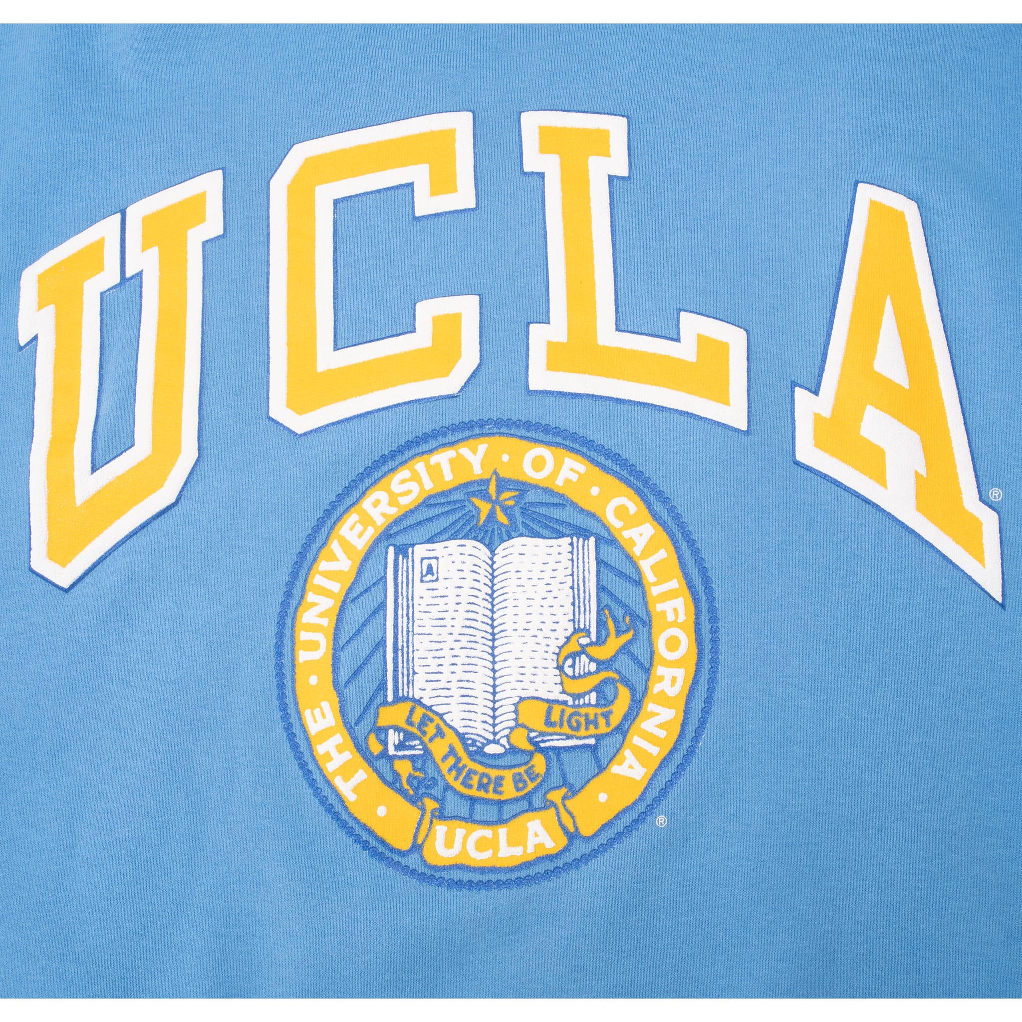 Close-up of gold and white UCLA lettering and University of California, Los Angeles seal