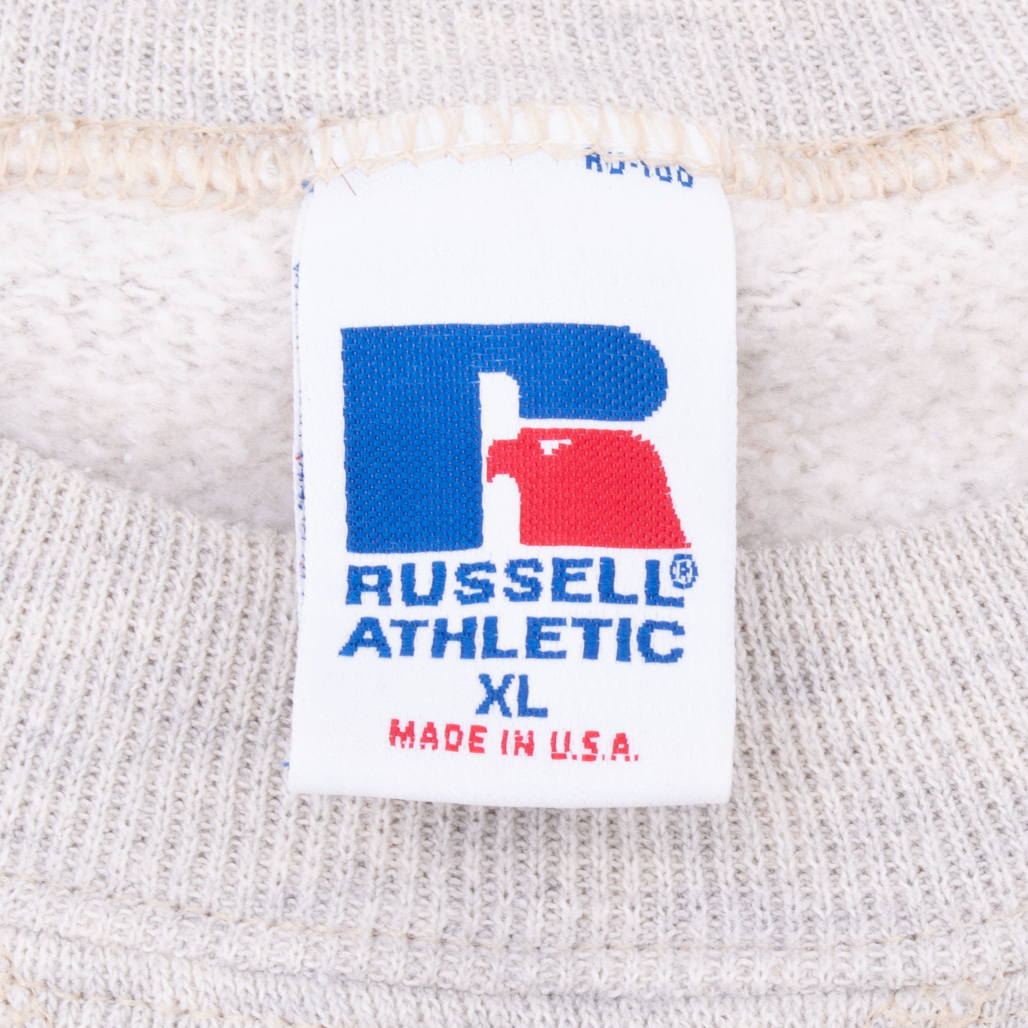 Russell Athletic XL neck tag with Made in U.S.A. text inside grey sweatshirt