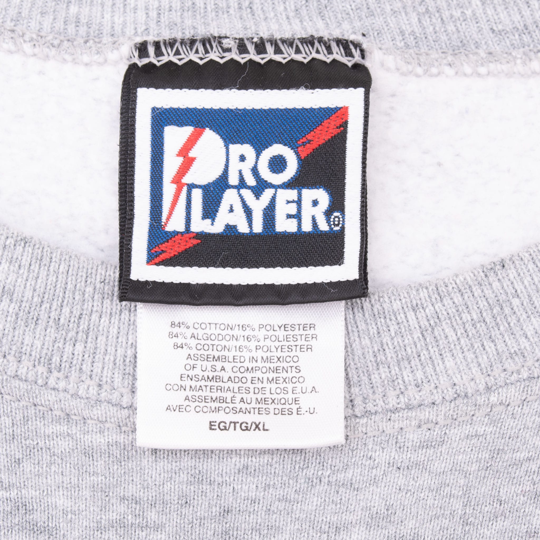 Pro Player neck label and fabric care tag inside grey sweatshirt