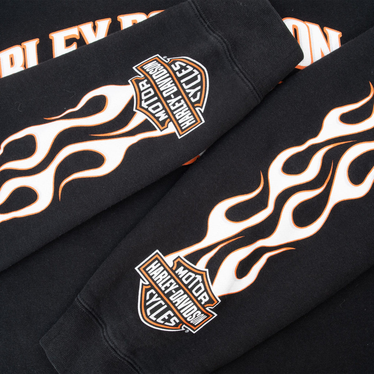 Both sleeves with orange-and-white flames and Harley-Davidson Bar & Shield graphics