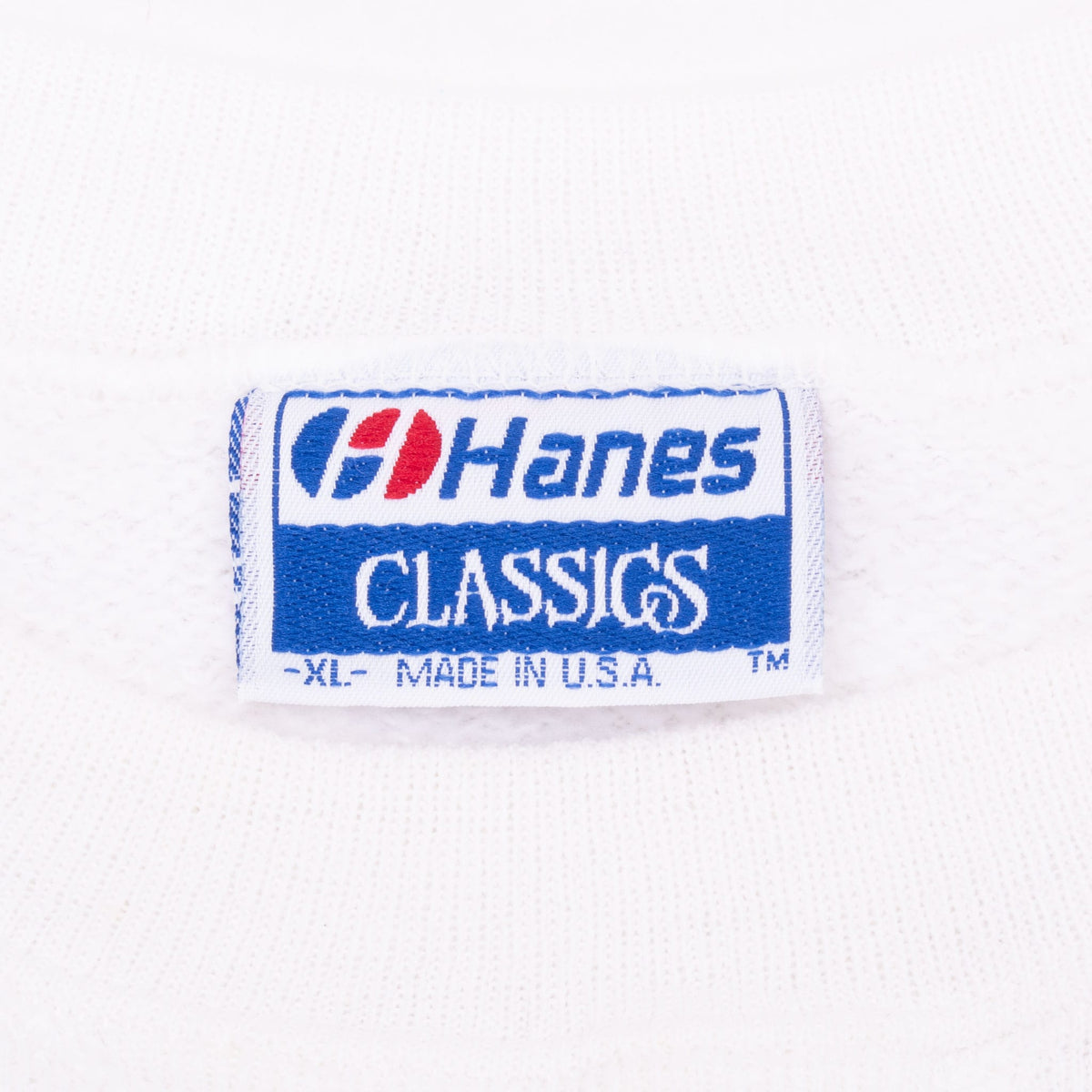 Hanes Classics XL Made in USA neck tag on white sweatshirt