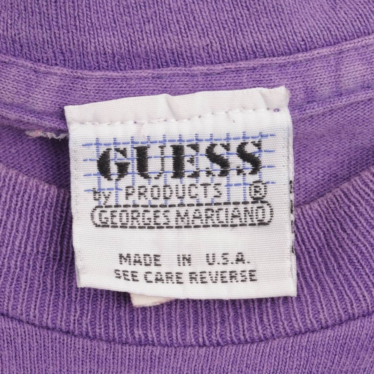 Guess Products by George Marciano neck label on purple T-shirt