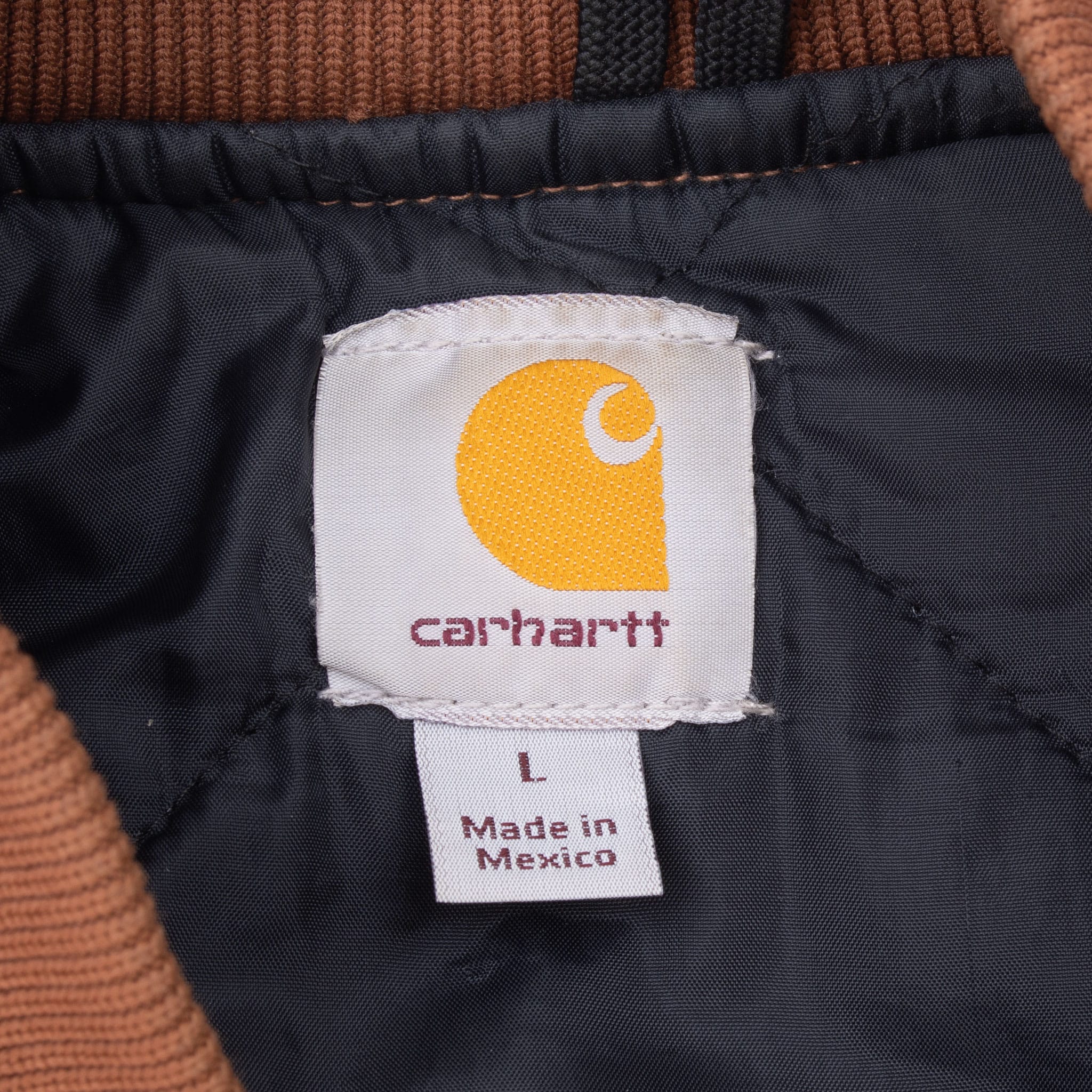 Carhartt interior neck label marked size L and Made in Mexico