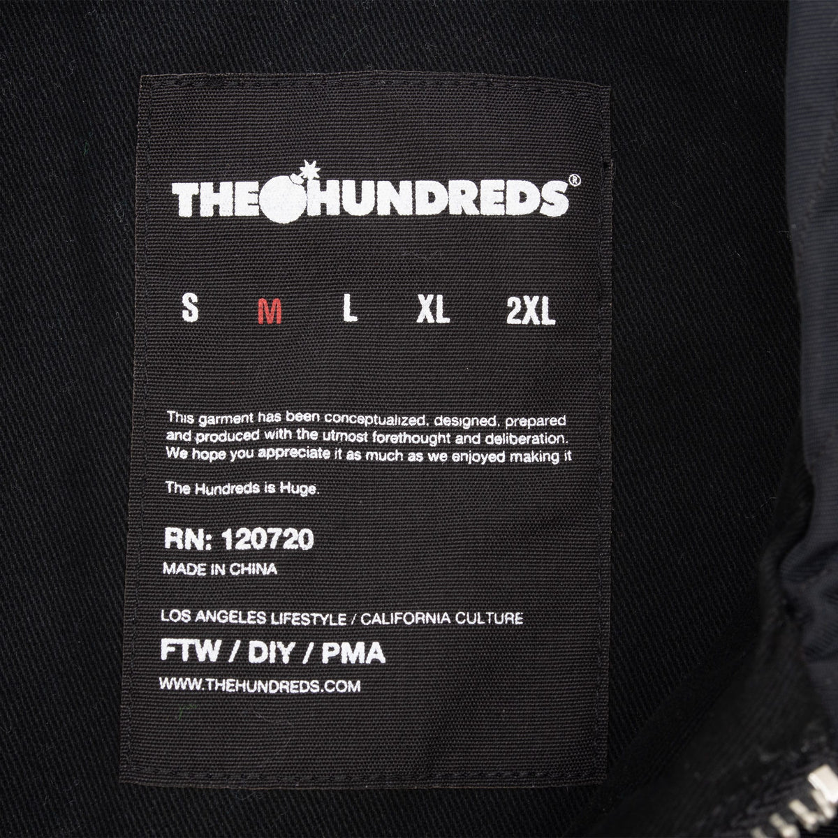 The Hundreds interior jacket label with medium size marked in red