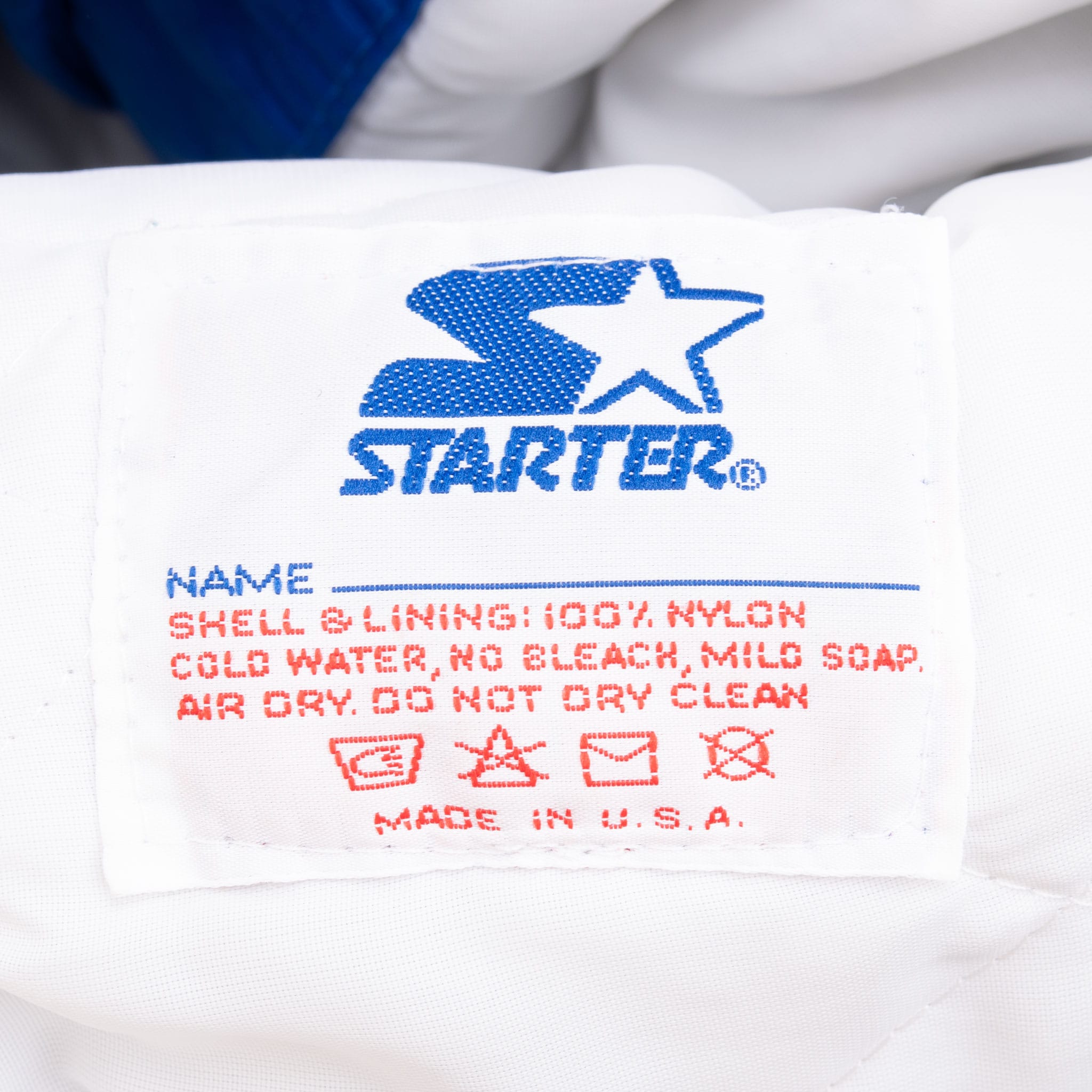 Starter care label with nylon shell and lining details and Made in USA text