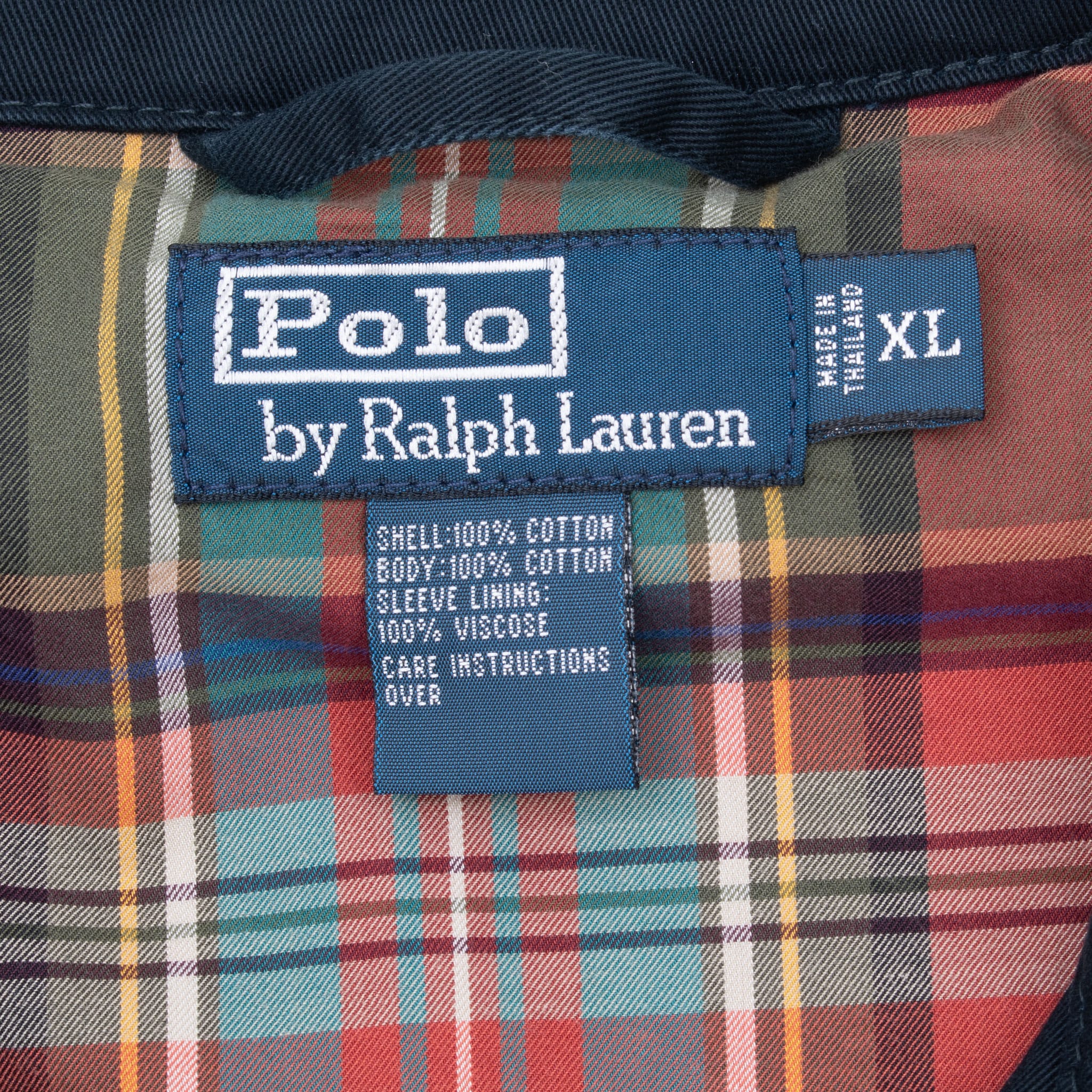 Polo by Ralph Lauren XL label against multicolor plaid lining