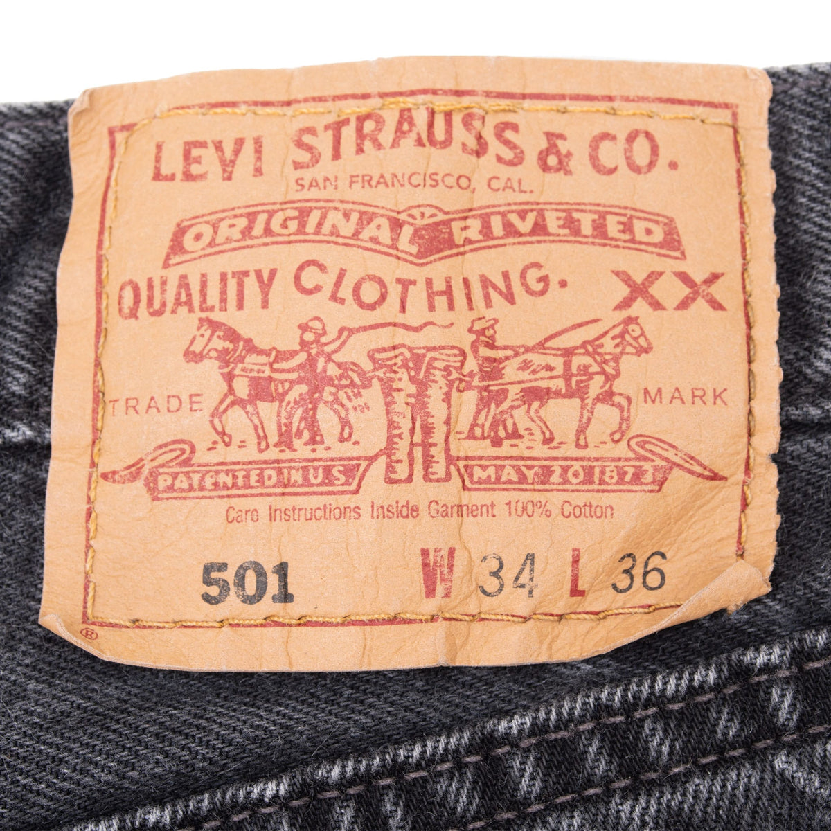 Levi Strauss & Co. 501 waist patch marked W34 L36 on black jeans