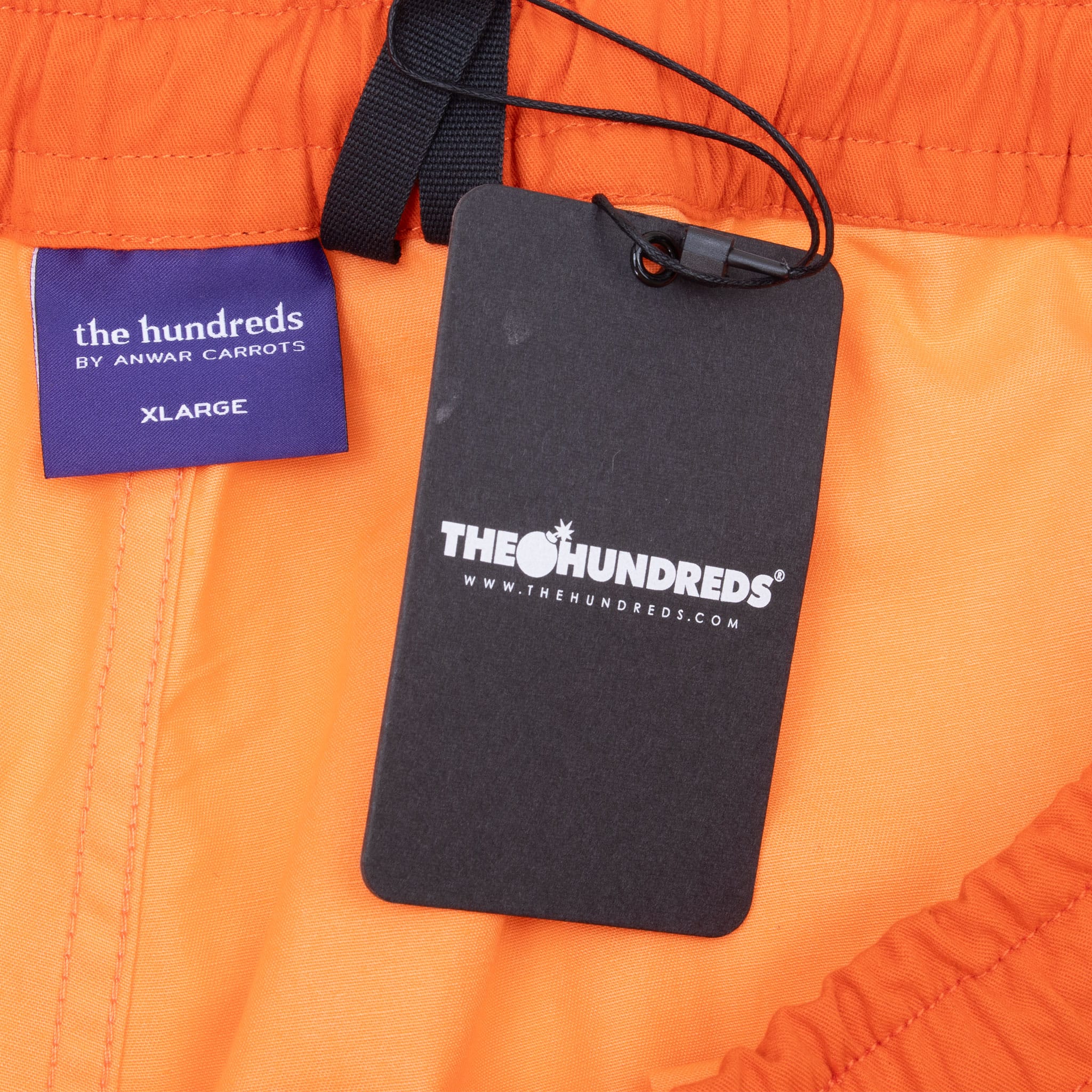 The Hundreds by Anwar Carrots XL label and attached hangtag inside orange jogger pants