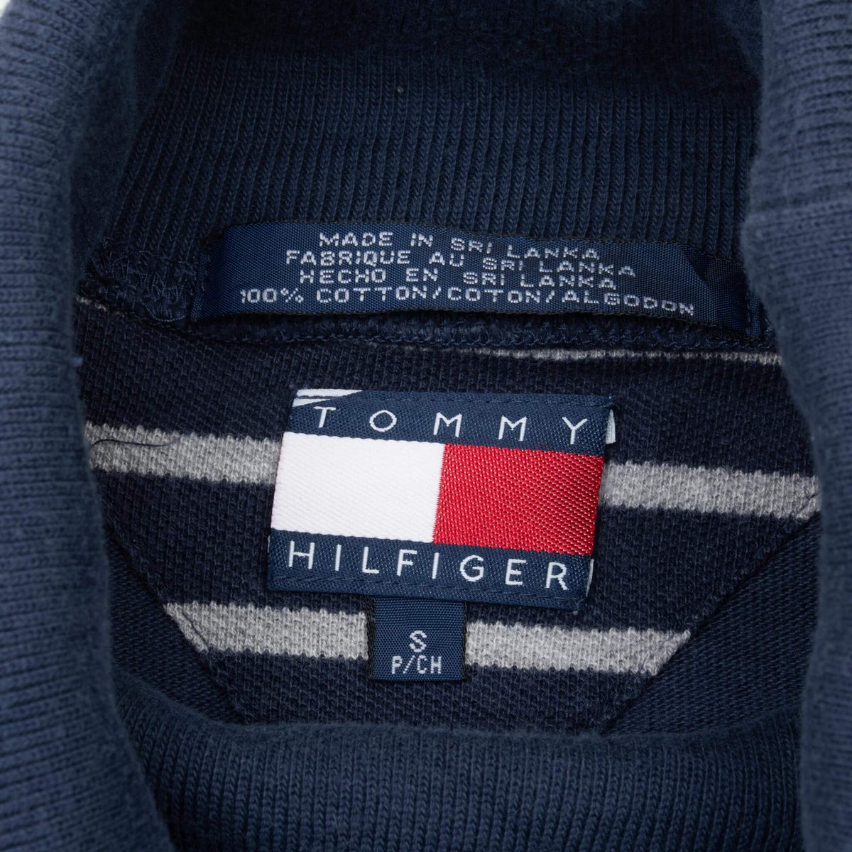Tommy Hilfiger neck label showing size small and cotton care label