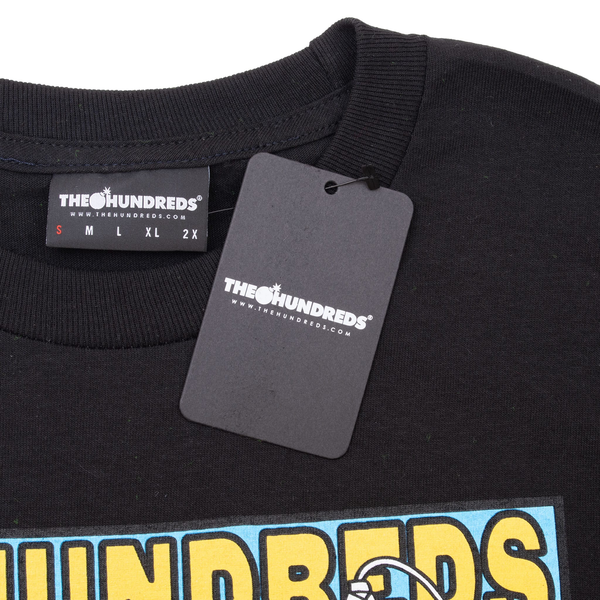 The Hundreds size small neck label and attached black hangtag on the T-shirt