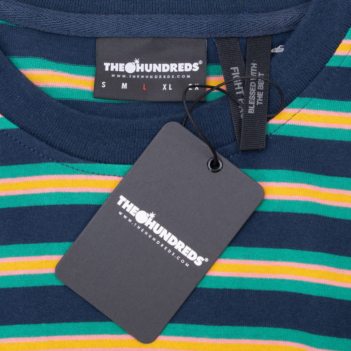 The Hundreds neck label and attached black hangtag on navy striped T-shirt