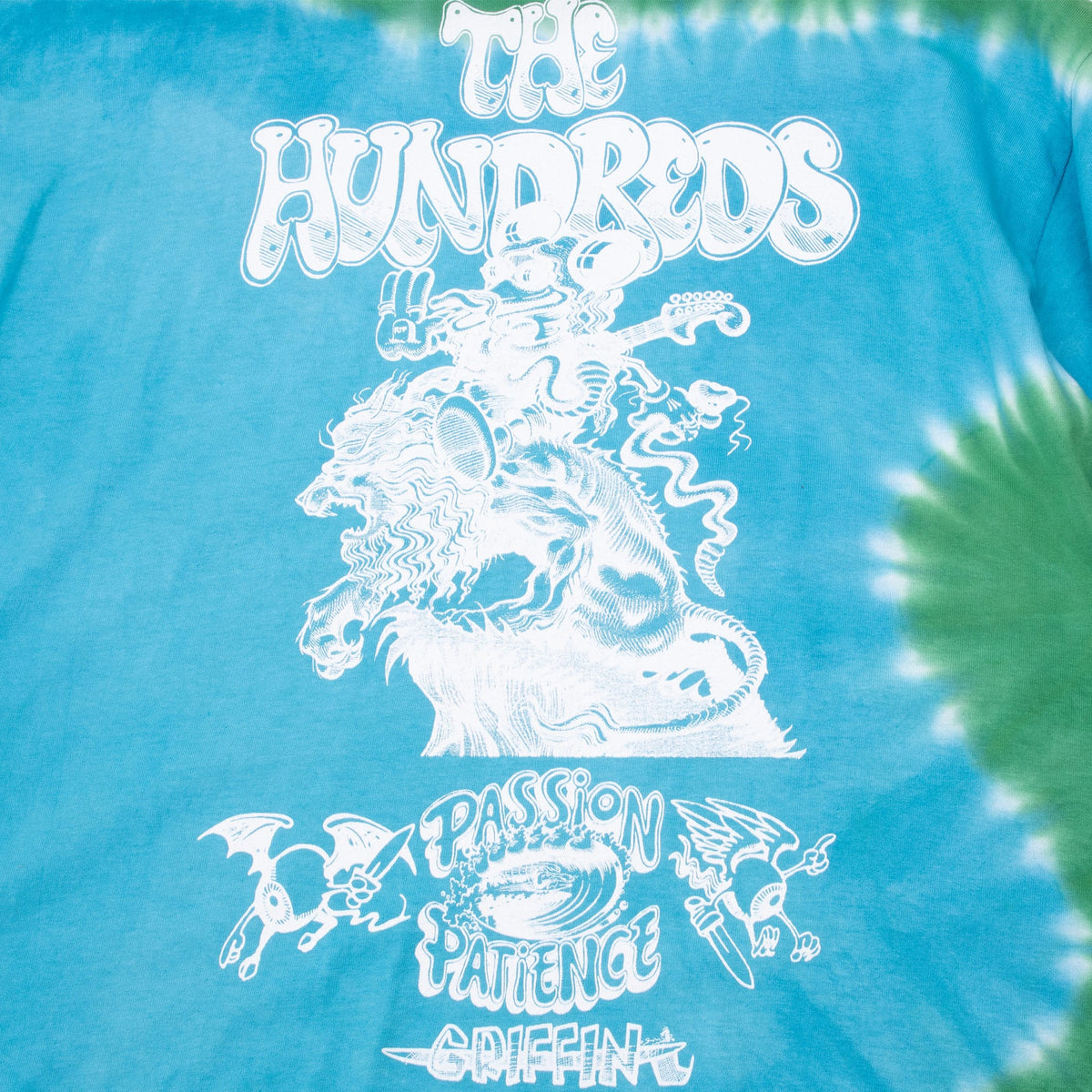 Close-up of white The Hundreds and Passion Patience Griffin front print on blue-green tie-dye