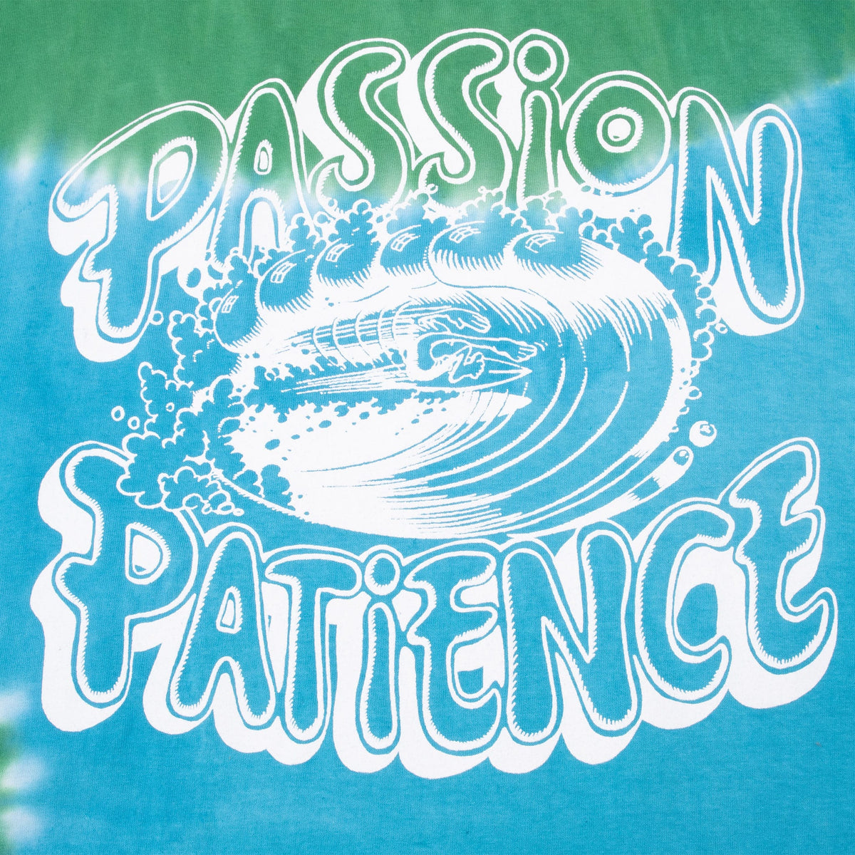 Close-up of white Passion Patience wave graphic on blue and green tie-dye back