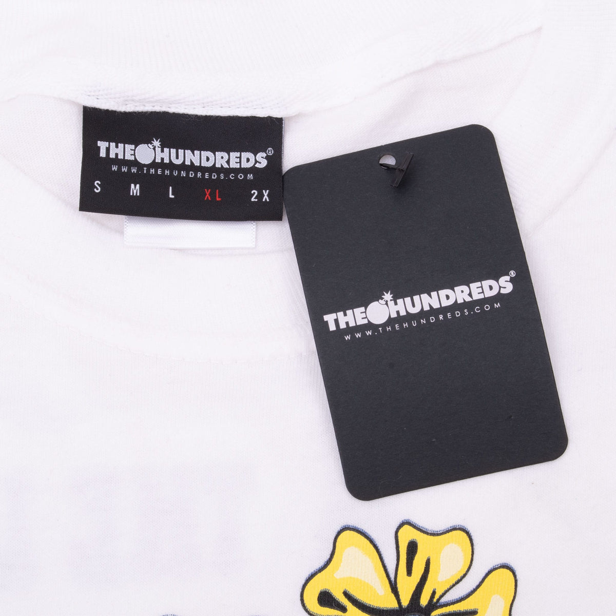 The Hundreds XL neck label and black hangtag on white T-shirt