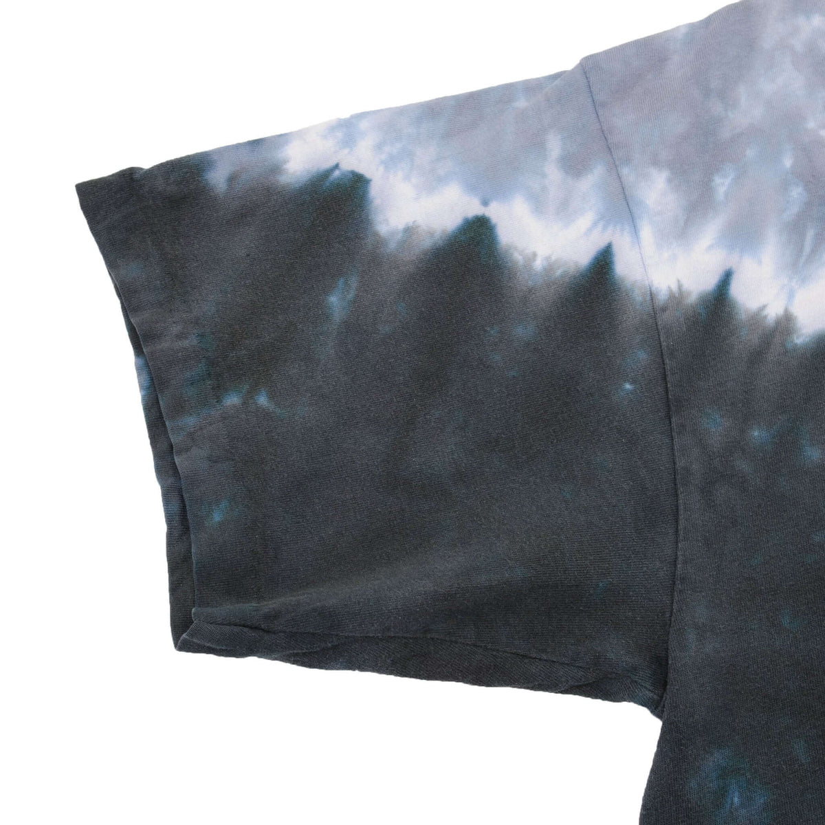 Close-up of black and gray tie-dye T-shirt sleeve and stitching