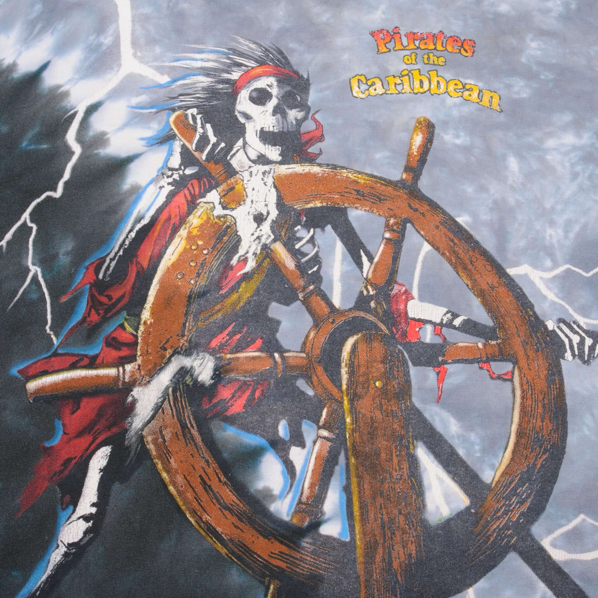 Close-up of Pirates of the Caribbean skeleton pirate and ship's wheel front print