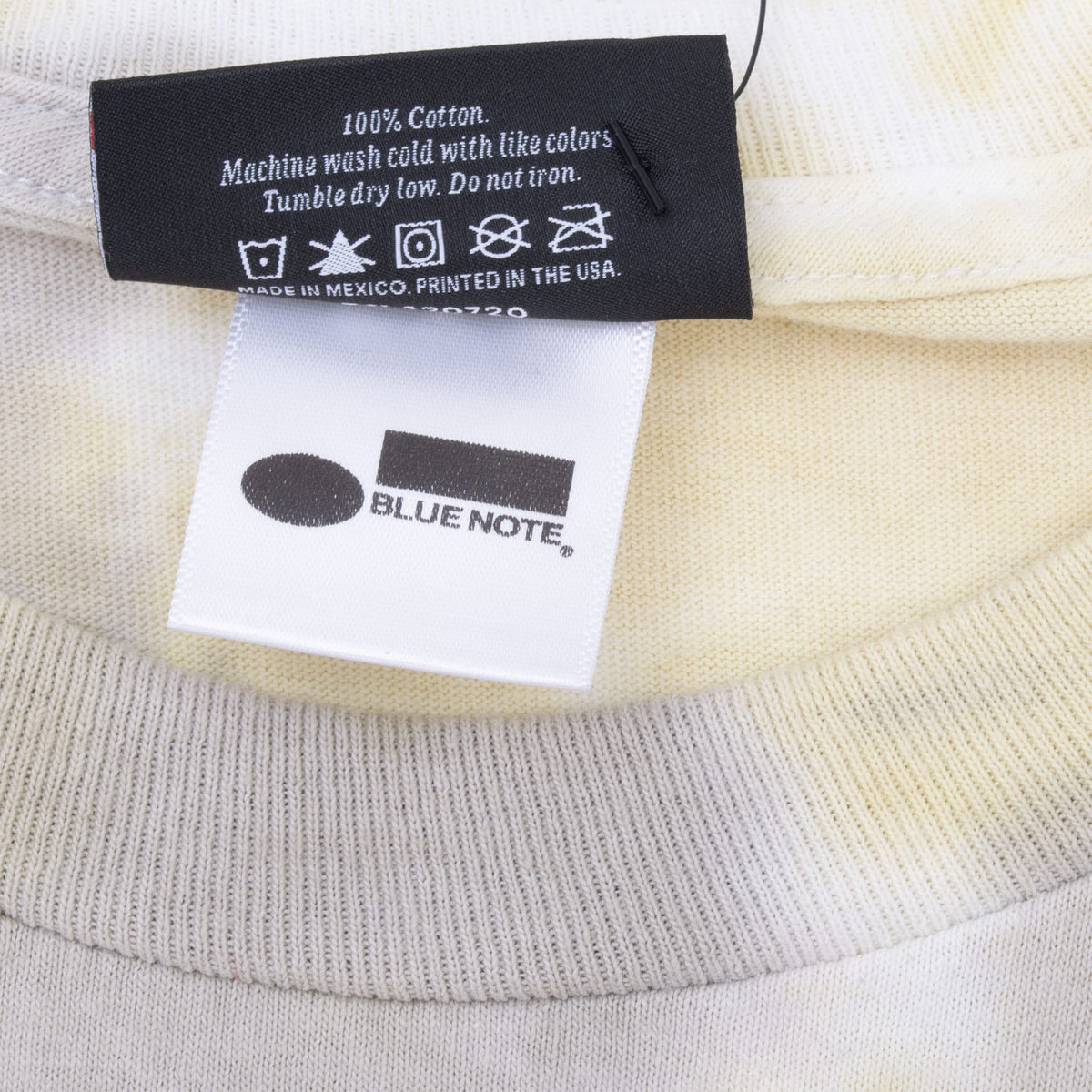 Close-up of care tag and Blue Note neck label inside the T-shirt