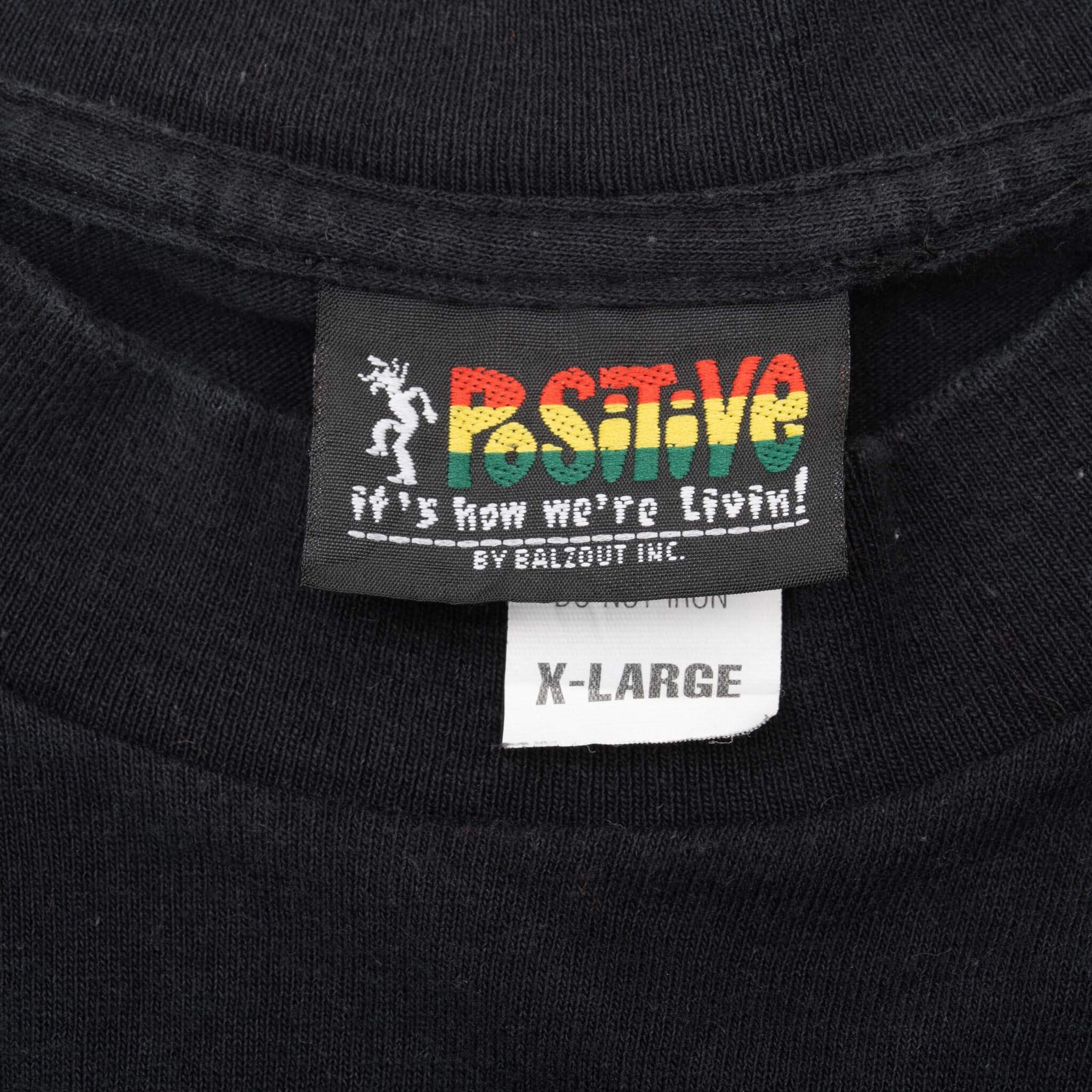 Positive by Balzout Inc. neck label with red, yellow and green logo and X-Large size tag