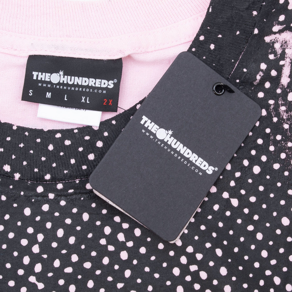 The Hundreds 2XL neck label and attached black hangtag on pink Carol T-shirt
