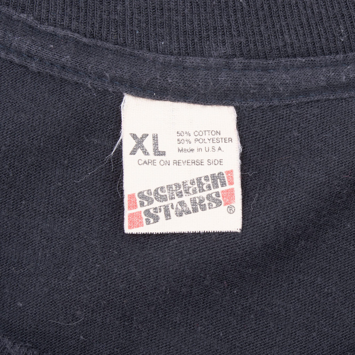 Close-up of Screen Stars XL neck label showing 50% cotton, 50% polyester and made in USA