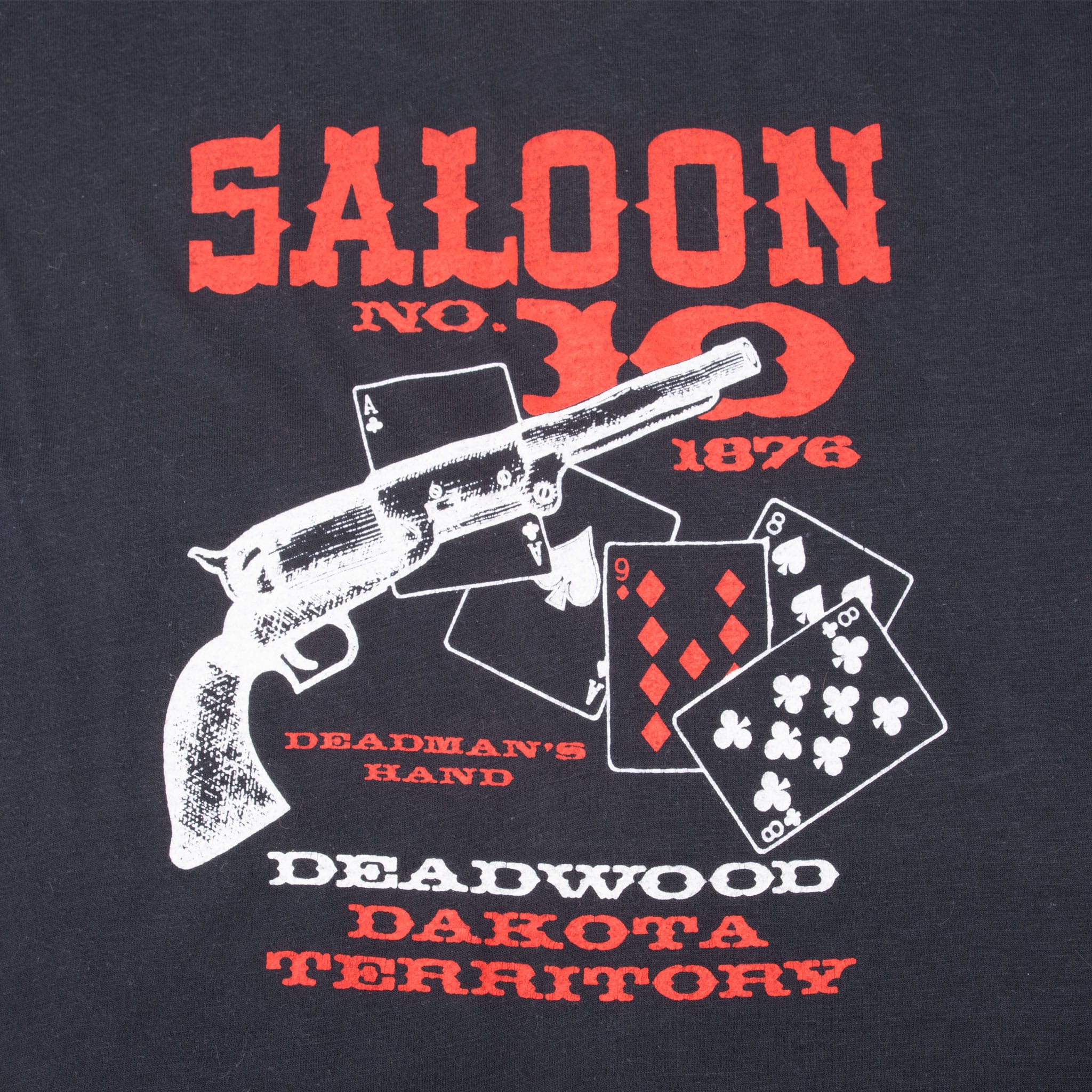 Close-up of Saloon No. 10 back graphic with revolver, Deadman's Hand cards and Deadwood lettering