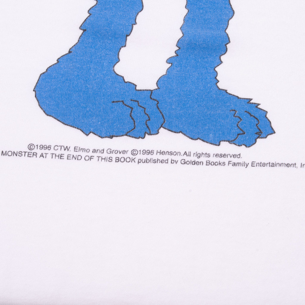 Close-up of Grover graphic feet and 1996 copyright text