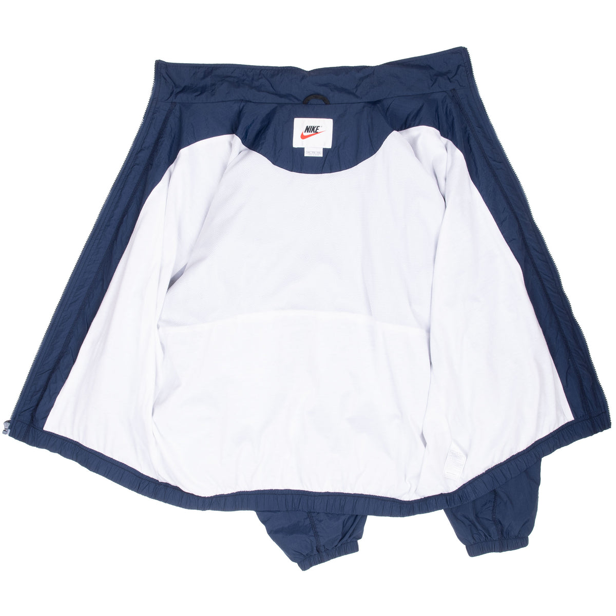 Open blue Nike windbreaker showing white interior lining and neck label