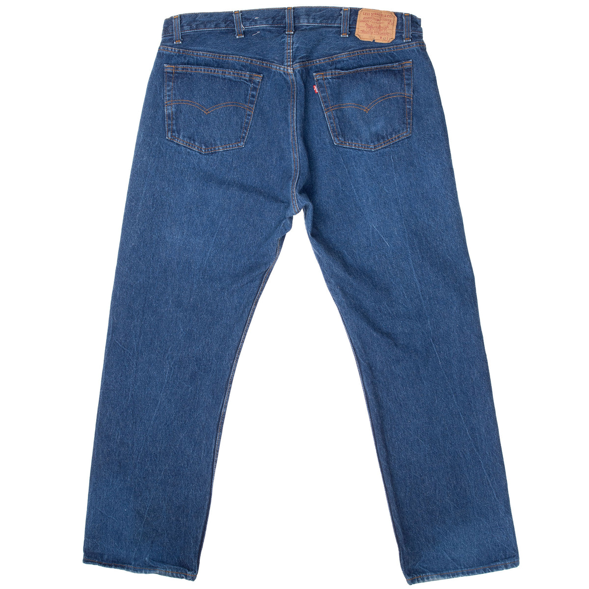 Back of Levi's 501 indigo blue jeans with two pockets and tan waistband patch